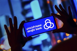 In this photo illustration, the Al-Rajhi Bank logo is displayed on a smartphone screen