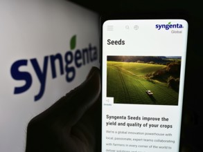 Stuttgart, Germany, 06-24-2024: Person holding cellphone with webpage of Swiss agritech company
