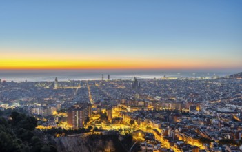 The Barcelona skyline with the Mediterranean Sea in front of sunrise