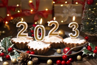 Food tray with cupcakes new year candles and christmas decorations