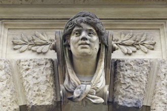 Stone head on a façade