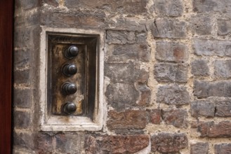 An old antique doorbell of a Sienese residential house, Italy