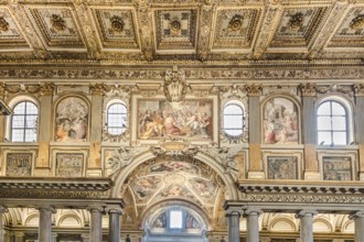 Coffered ceiling of the right aisle with a view into the domed chapel of the capella sistina of the