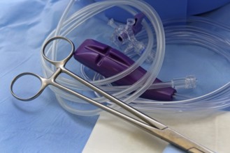 Grain tongs, three-way stopcock, medical tubing