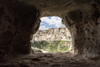 Scenic view of historic downtown with its cathedral, photo taken from a cave house, Italy