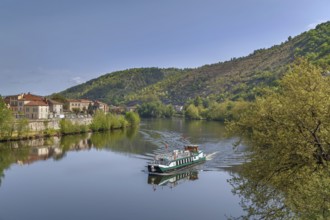 View of Lot river with ship in Cahors, France