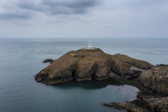 Aerial landscape view of the Pembrokeshire coast with the historic Strumble Head Lighthouse