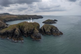 Aerial landscape view of the Pembrokeshire coast with the historic Strumble Head Lighthouse