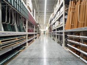 Store for home improvement and DIY. Warehouse aisle of building materials in industiral store.