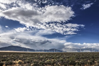 Wind turbines and wild thunder and rain clouds over the Great Basin Highway US 93, between Ely and
