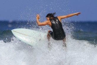 BELLS BEACH, AUSTRALIA, JANUARY 26 2024: Surfers in action at the iconic Bells Beach on a warm