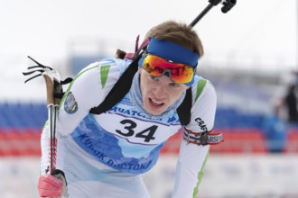 Russian sportsman biathlete Rusinov Vladislav Khanty-Mansiysk at finish after rifle shooting and