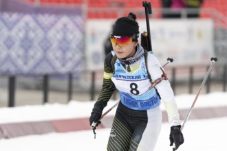 Korean sportswoman biathlete Lee Hyunju South Korea skiing at finish after rifle shooting during