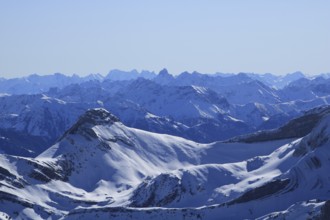 Snow covered mountain Ranges in the Swiss and Austrian Alps seen from Chaeserrugg