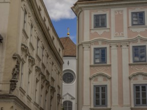 Historic buildings with ornate facades in a narrow alleyway in the historic town centre, Dürnstein,