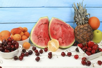 Summer berries and fruits on wooden background, healthy natural food concept, breakfast with