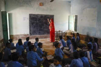 Teacher teaching students in school class room, Jaisalmer, Rajasthan, India, Asia