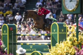 Erynn Ballard of Canada and riding De Flor 111 Z Santa Rosa compete in the first round of the 1.60m