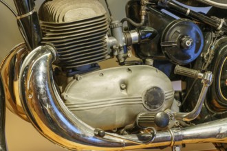 Chromed motorbike engine with visible valves and black frame, Einbeck, Germany