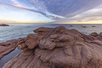Coastal landscape with bizarre red rocks and sea view, Spiaggia di Cala E'Luas, Ogliastra,