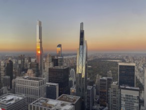 Sunset over the New York skyline with modern skyscrapers and a wide cityscape, the skyline of a big