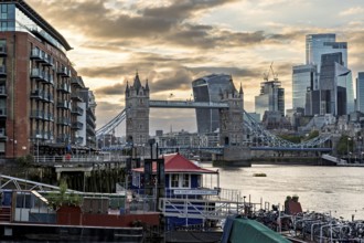 View over the Thames with Tower Bridge and the skyline in the evening light, London, England, Great
