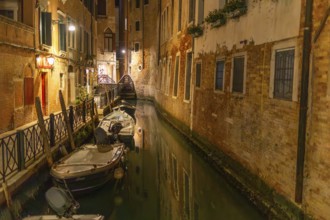 Boats in a canal in the historic centre, night shot, Venice, Italy