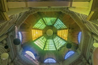 Macca Villacrosse Passage, a fork-shaped, yellow glass covered arcaded street in central Bucharest,