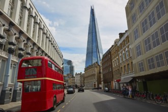 The Shard and old London red Bus in England