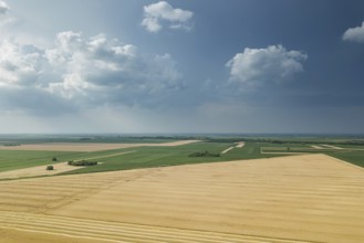 Aerial view of agricultural fields. Cloudy countryside, Aerial view