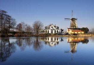 Windmill De Lelie in Rotterdam on the shore of lake Kralingse Plas