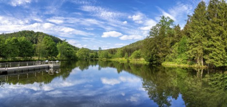 View at a lake in the Spiesswoogtal valley near the German village Fischbach bei Dahn in the