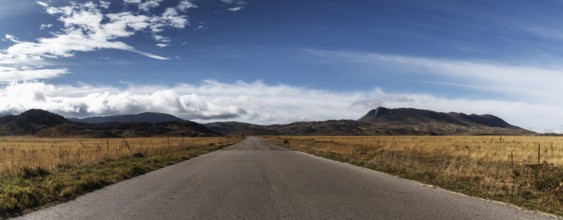A country highway leading into the distance in the Gran Sasso and Monti della Laga National Park in