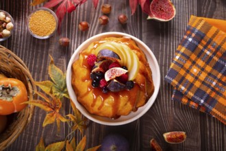 Delicious homemade autumn cake with figs and frozen berries for celebrating Thanksgiving day or