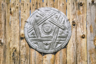 Old Shield on the Wooden Fence