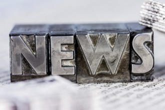The word News was written in lead letters. Symbol photo for newsletters, newspapers and Information