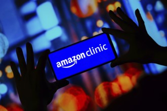 In this photo illustration, the Amazon Clinic logo seen displayed on a smartphone