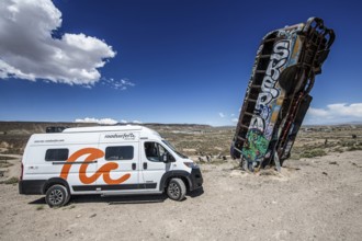 Motorhome and scrap cars decorated with graffiti in the Carforest of Goldfield, Nevada, USA
