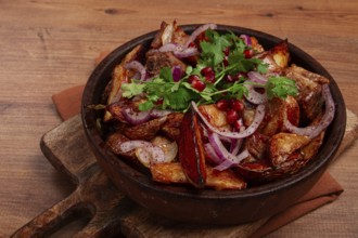 Ojakhuri, a traditional Georgian dish, fried potatoes with meat, in a clay pan, top view, without