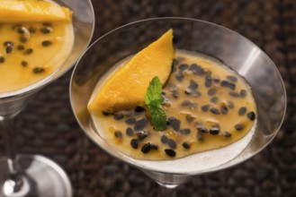 Panna cotta dessert with passion fruit and mint