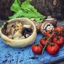 Vegetable hot plate made of baked dough cooked in a rustic style.Photo tinted