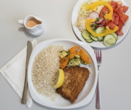 Cordon bleu filled with cheese and ham with salad - Schnitzel, bird's eye view