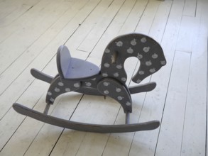Wooden horse on the floor in vintage interior