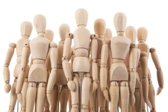 Many wooden mannequins isolated over white