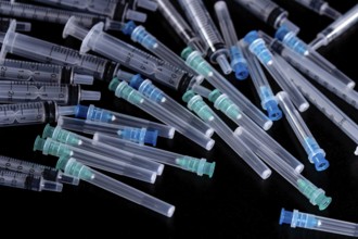 Medical Sterile Syringes Needles, Close up Syringes on Black Background
