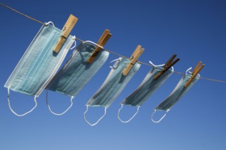 Photographic representation of the recovery of the anti Covid-19 masks washed and hung out in the