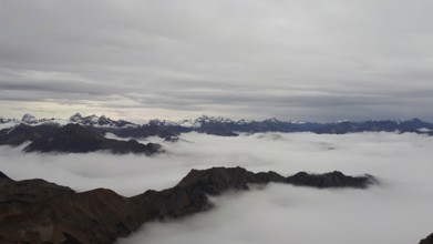 Fog fills the valleys below the Neblehorn in the Allgäu