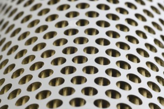 Detail of a tractor oil filter creates an industrial textured background