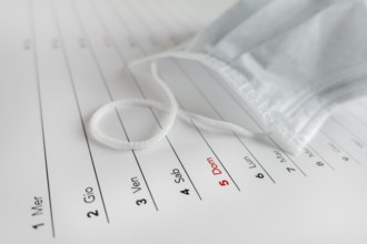 Montly calendar with self protection face mask. Coronavirus concept. Beginning / end of the