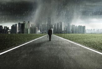 Business man facing a storm, victory concept
